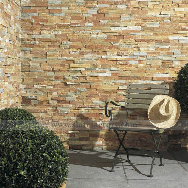 golden white stacked stone panels retaining wall